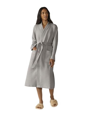A pale organic cotton waffle-weave robe with a tie belt, folded.