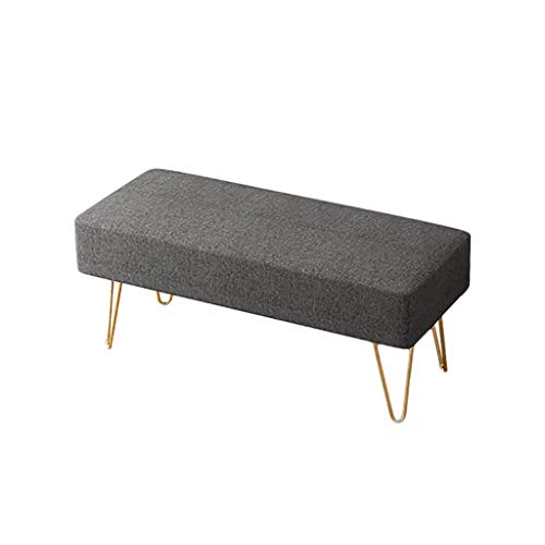 Banc de chevet design en bout de lit pour une chambre ordonnée