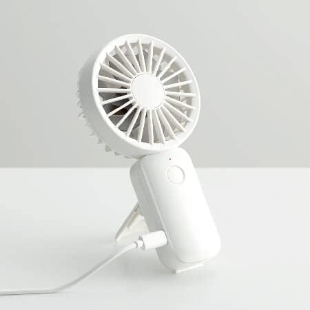 Rhythm Air fan connected to a USB-C charging cable