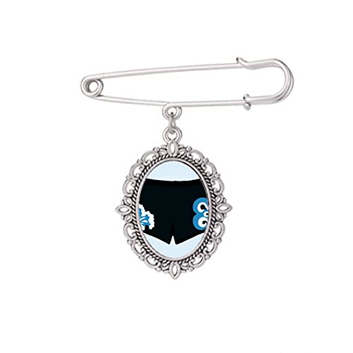 Broche noire motif trommes pour accessoiriser un châle en automne