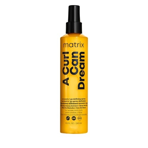Frasco do spray modelador de cachos Matrix A Curl Can Dream na cor amarela, com tampa borrifadora preta e informações do produto estampadas.