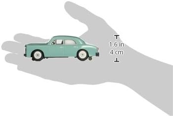Bachmann E-Z Street O Scale Sedan in hand for scale