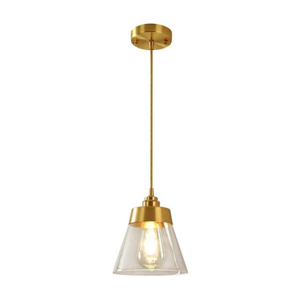 Lustre en métal pour table de chevet créant une ambiance chaleureuse dans la chambre.