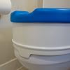 Deluxe, Padded SOFT-TOPTM 4 Raised Toilet Seat. Elevated Riser Fits Round Toilets. Includes Soft Close Lid and discreet SAFE-LOK mounting technology.