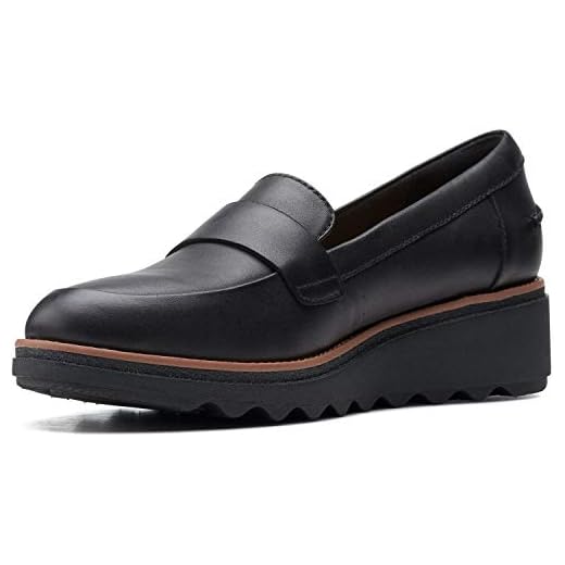 Clarks womens Sharon Gracie Penny Loafer, Black Leather With Dark Tan Welt, 9 US