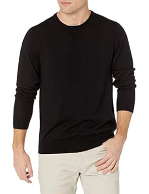 Man wearing goodthreads black sweater on a white background.