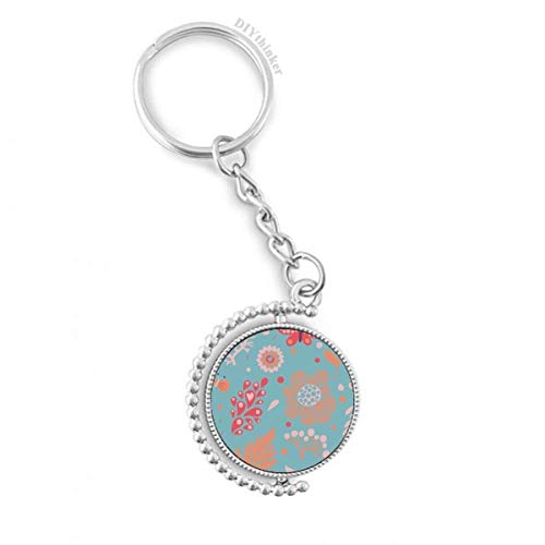 Llavero giratorio con diseño floral azul de hojas pintadas para organizar tus llaves