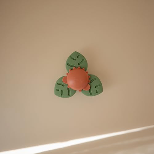 Image of mushie Dino Suction Spinner Toy | Toddler Sensory Toys for Bath & Play