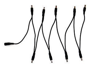 Powers 1 to 9 Effects Pedals 2.1mm x 5.5mm connection size Sends the correct power to each pedal Re-inforced with extra thick flexible cable 18cm between each connection (144cm in total)