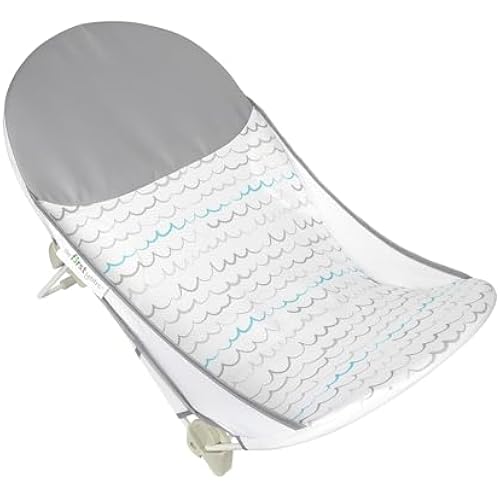 The First Years Sure Comfort Folding Baby Bather - Foldable Baby Bath Seat and Lounger for Home or On the Go - for Sink or Tub Use - Non-Slip Seat - For Up to 15 Lbs