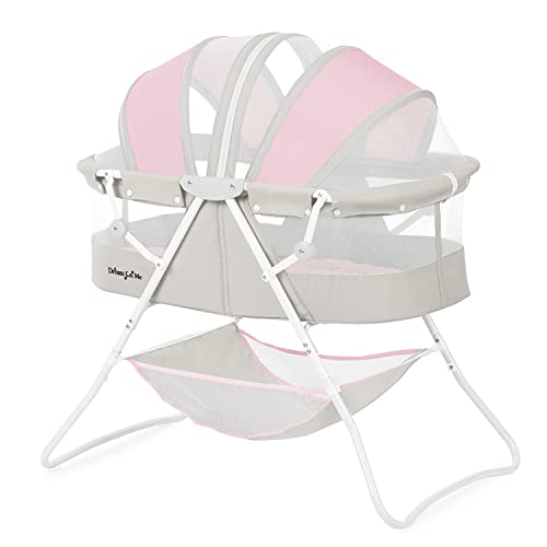 Image of Dream On Me Karley Baby Bassinet in Grey and Pink, Lightweight Portable, Quick Fold and Easy to Carry , Adjustable Double Canopy, Indoor and Outdoor with Large Storage Basket.