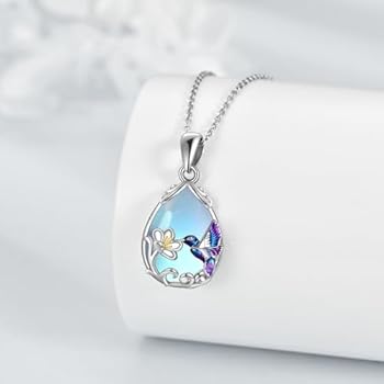 Zilveren collier met vogel hanger en maansteen » Orfèvre Edelsmederij