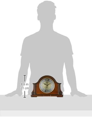 Bulova B1975 Chadbourne Old World Clock shown next to a person for scale, highlighting its dimensions of 8.25 inches high and 12.5 inches wide.