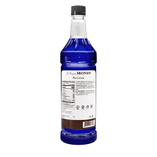 Monin - Premium Blue Curacao Syrup | Iconic Blue Hue & Zesty Sweetness for Cocktails & Creations | No Artificial Flavors Or Preservatives (BPA Free Bottle, 33.8 fl oz)