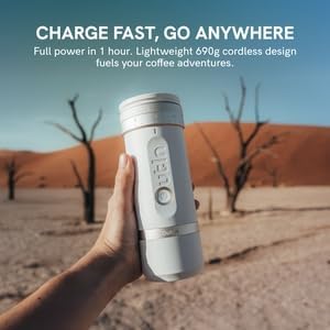 OutIn Fino Portable Electric Coffee Grinder being charged via USB-C