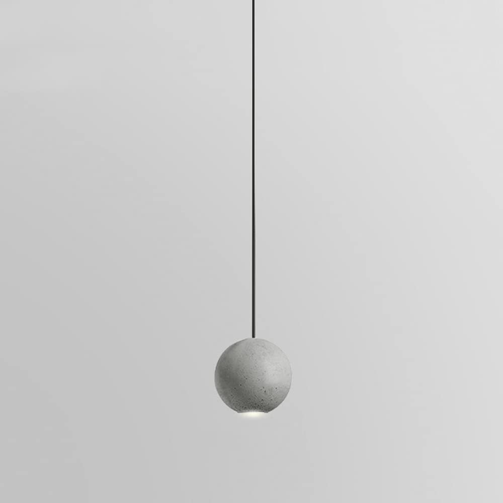 Petit lustre suspendu en ciment pour éclairer un chevet ou un bar