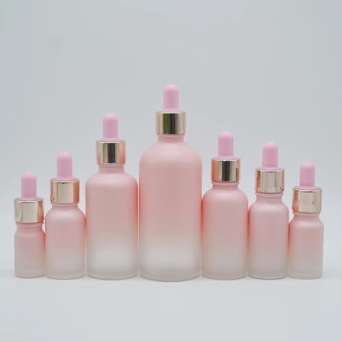Flacon compte-gouttes en verre rose givré et bague or raffinée 100ml