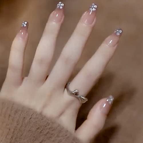 Image of Secret Lives fake artifical acrylic press on nails transparent & brown color false nails extension with silver glitter flower design & 3D white pearls design 24 pieces set with glue sheet stickers