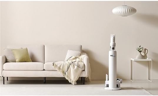EZIclean Cyclomax R22 Station docked in its automatic emptying station next to a sofa.