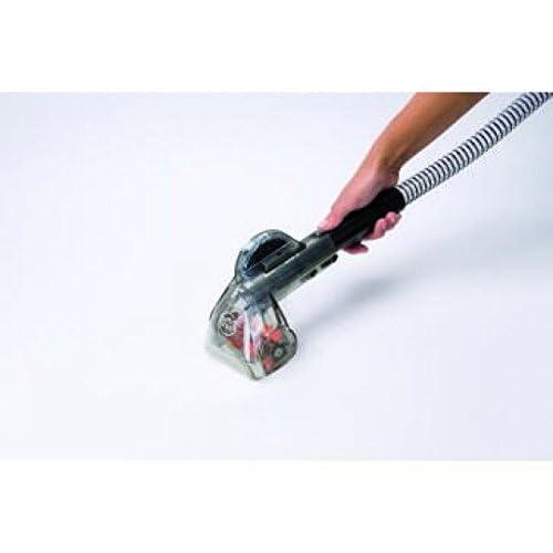 Using the hose and upholstery tool