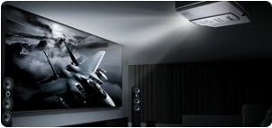 BenQ SP890 projector mounted on a ceiling, projecting a large, high-definition image of a jet fighter onto a screen in a dimly lit room, showcasing its home theater or presentation capabilities.