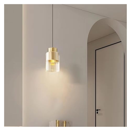 Lámpara colgante moderna de cristal sobre isla de cocina y mesa de comedor