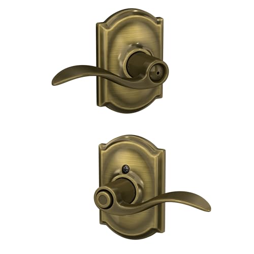 Image of Schlage Accent Lever with Camelot Trim Bed and Bath Lock in Antique Brass - F40 ACC 609 CAM