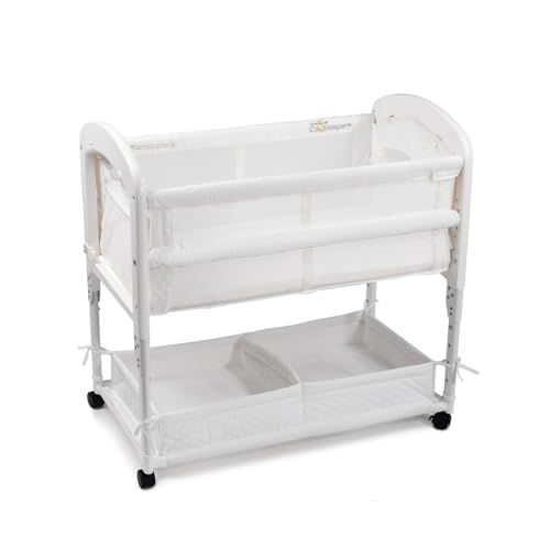 Arm’s Reach Cambria Co-Sleeper Bedside Bassinet Featuring Height-Adjustable Legs, Curved Wooden Ends, Breathable Mesh Sides with Pockets, and Large Lower Storage Basket, White