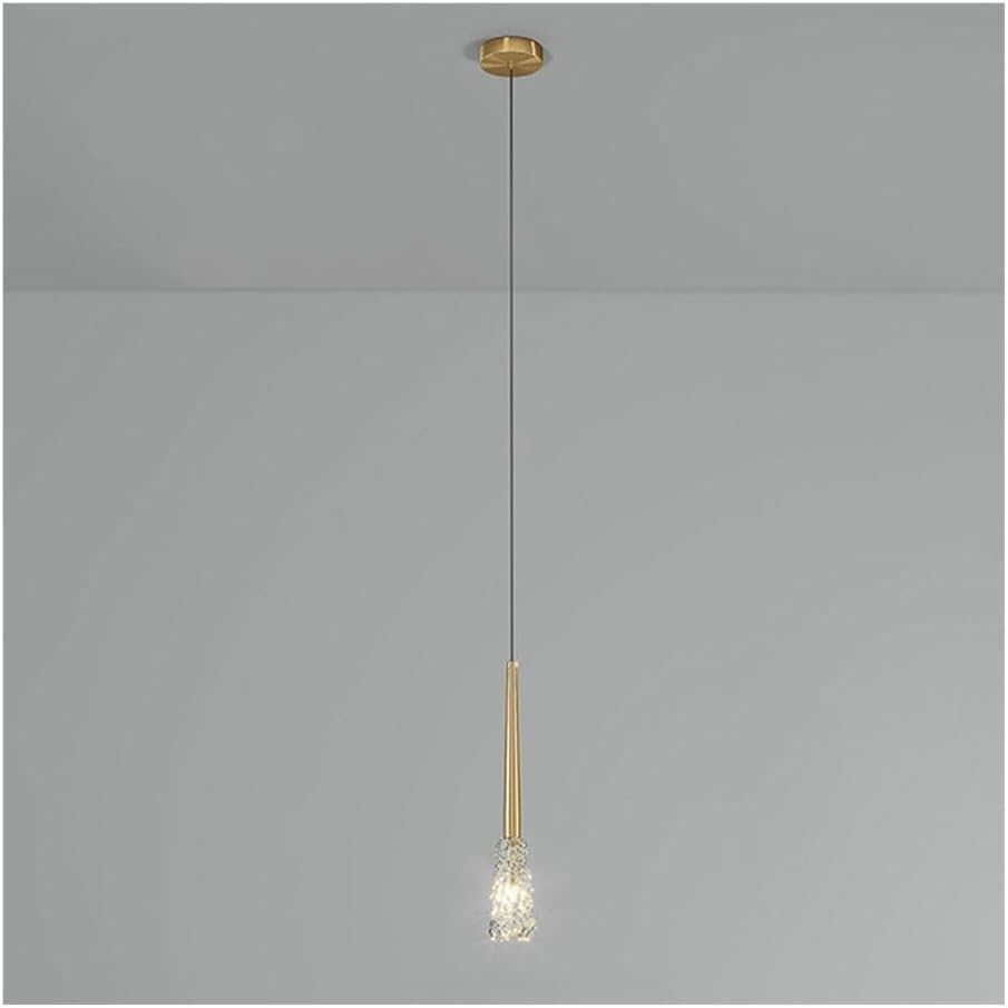 Lustre en cuivre doré pour illuminer une table de chevet trop sombre