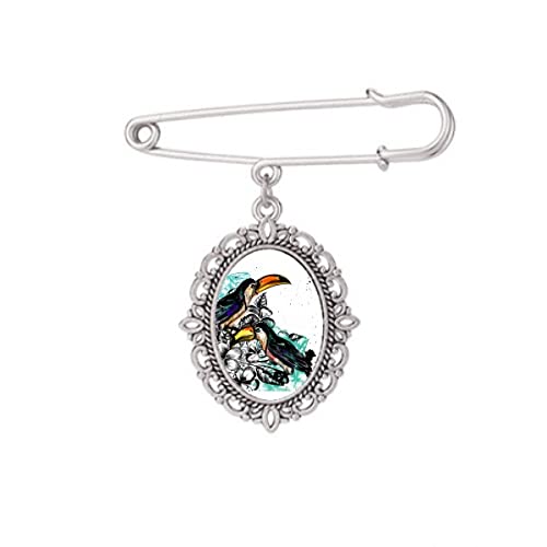 Broche oiseau tropical Toco, la solution artistique pour ajuster et égayer un châle ou une robe