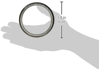 Hand holding a Timken 3720 Wheel Bearing with a measurement overlay showing 3.8 inches (9 cm) in height.