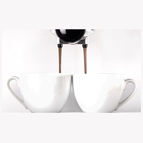 Espresso pouring into two white cups
