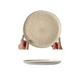 La texture de l'assiette est stable et lourde, avec un style industriel lourd, soulignant le sentiment de qualité et rendant l'expérience culinaire plus élégante.