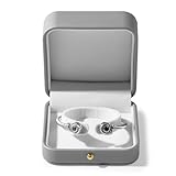 Avec un bouton en acier inoxydable raffiné. Ce bouton sert uniquement à des fins décoratives, il ne permet pas d'ouvrir la boîte. Cette boîte à bracelets, à montres et à petits bijoux complète le style de vos bijoux les plus élégants.