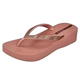 Flip flops del estilo elegante que da feminidad, alegría y glamour
