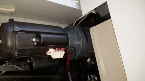 Internal view of the paper cutter's motor and mechanical components.