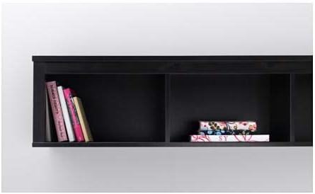 HEMNES Wall/bridging shelf installed on a white wall with books and decorative items