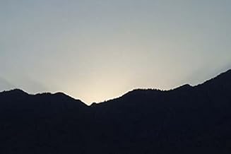 The sun sets behind the desert mountain as seen from the Palm Springs airport Poster Print by Jason Pierce (18 x 24)