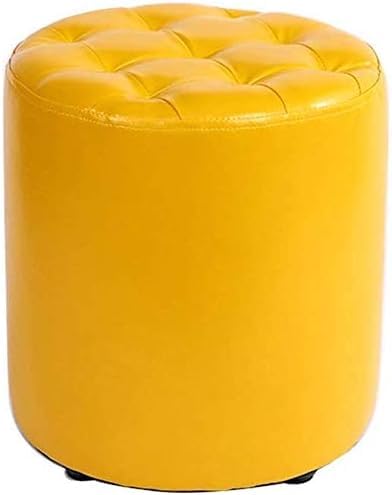 Tabouret bas jaune en cuir synthétique pour soulager les jambes après le travail