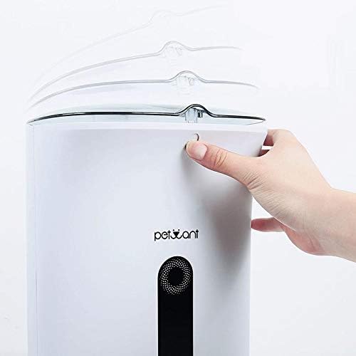 Opening the lid of the pet feeder to fill food