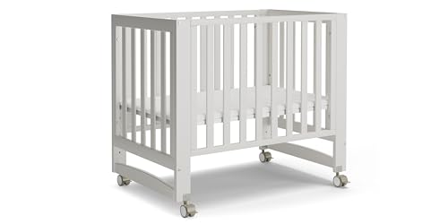 Image of MAMAZING EvoNest 6-in-1 Convertible Baby Mini Crib with Wheels | GREENGUARD Gold Certified, New Zealand Pine Wood, 4 Adjustable Heights, Rocking Mode, Small Spaces Design, White