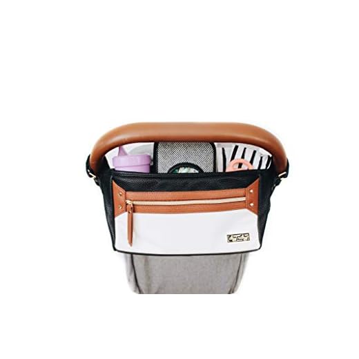 Itzy Ritzy Adjustable Stroller Caddy – Stroller Organizer Featuring Two Built-in Pockets, Front Zippered Pocket and Adjustable Straps to Fit Nearly Any Stroller, Coffee and Cream