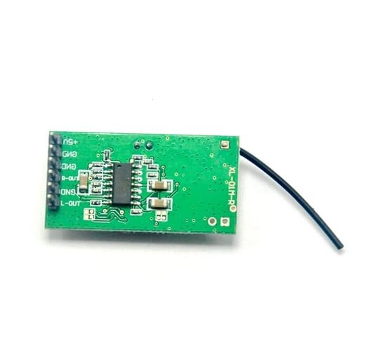 The underside of one green circuit board module, showing solder points and pin labels such as +5V, GND, R-OUT, L-OUT, and various other connections.