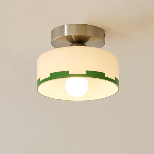 Lámpara de techo de vidrio con leche que difumina una luz suave en cocina