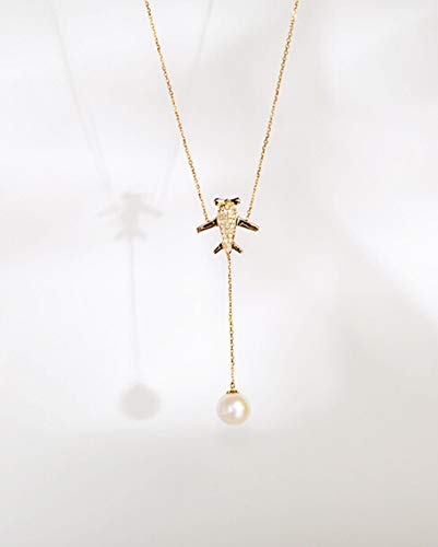Collier en or rose 18 carats avec pendentif avion en nacre et diamant