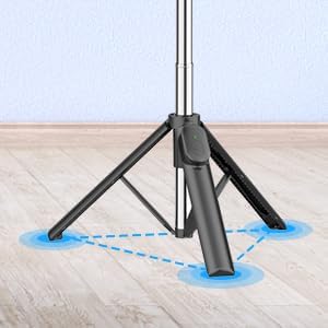 Խոշոր պլանով view of the tripod base of the selfie stick, showing the stable three-point contact with the ground.