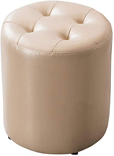 Pouf ottoman rond en cuir champagne pour créer un coin lecture cosy dans la chambre