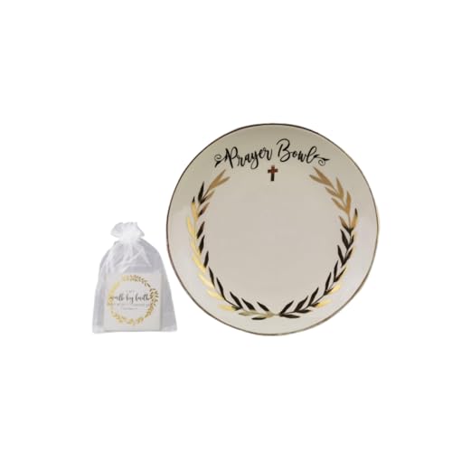 A large ceramic decorative bowl filled with a stack of small prayer cards