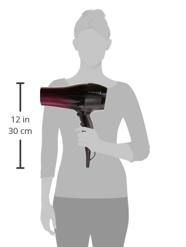 Remington D5950 Ultimate Smooth Dryer held by a person for scale