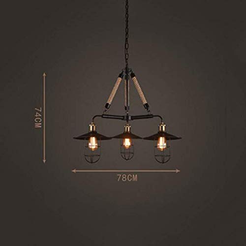 Lampes suspendues rétro industriel pour transformer un salon sombre en espace bistrot chic